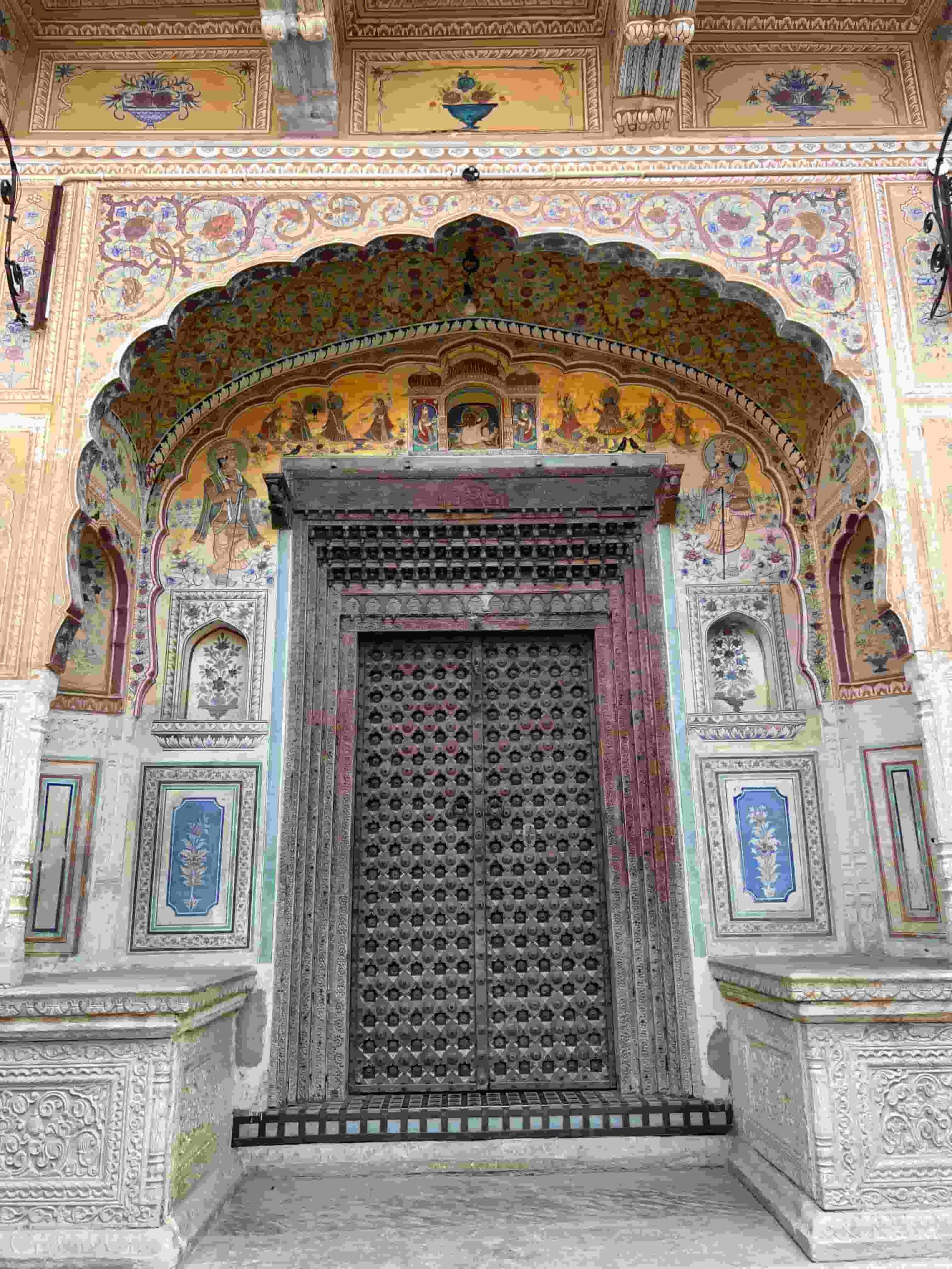 Intricate, hand painted door of boutique accommodation in Mandawa, India