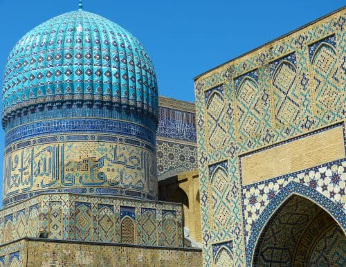building in Uzbekistan with blue and yellow tiles