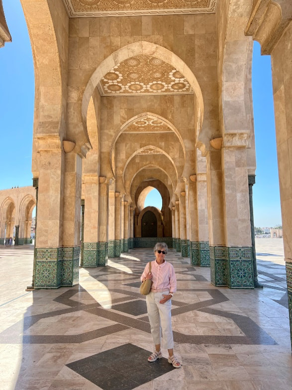 person standing under tiled archway