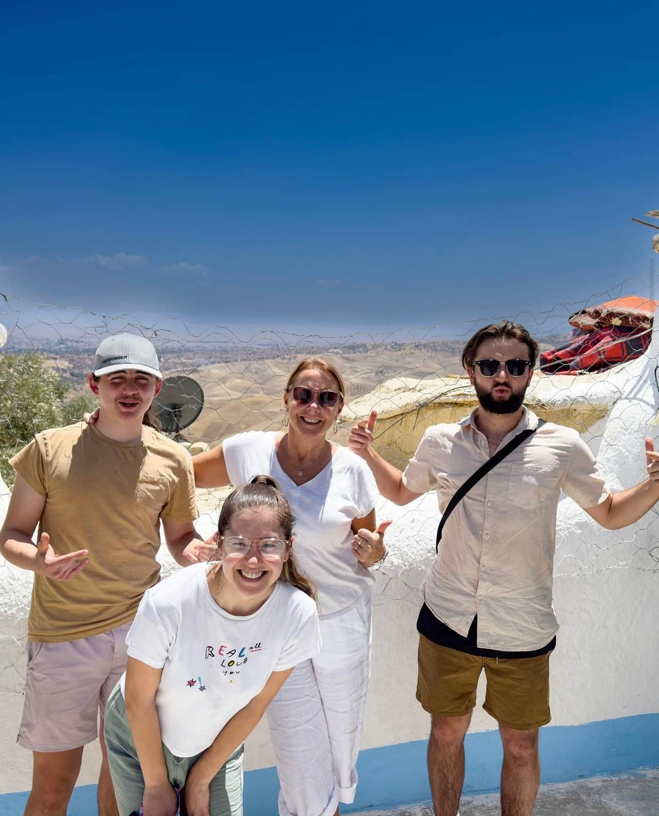 4 people standing near wall in Morocco