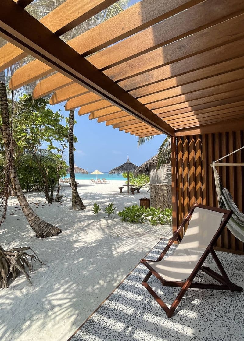 deck chair on verandah with ocean in distance