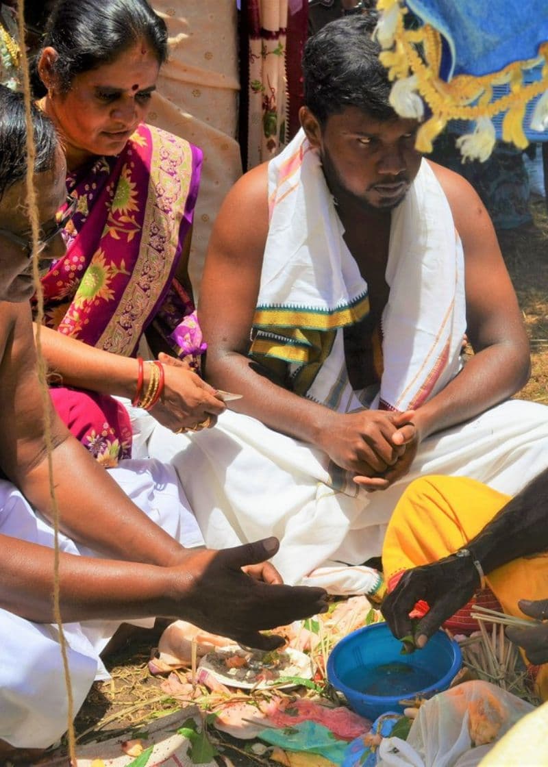 Indian man and tourist tolding handmade tile