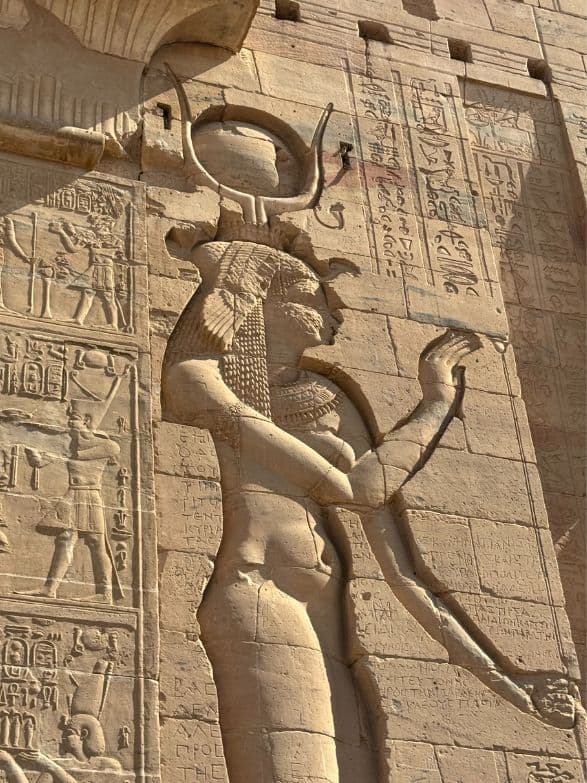 person standing under tiled archway